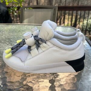 Waterproof Sorel White Sneakers with Black and Yellow Accents